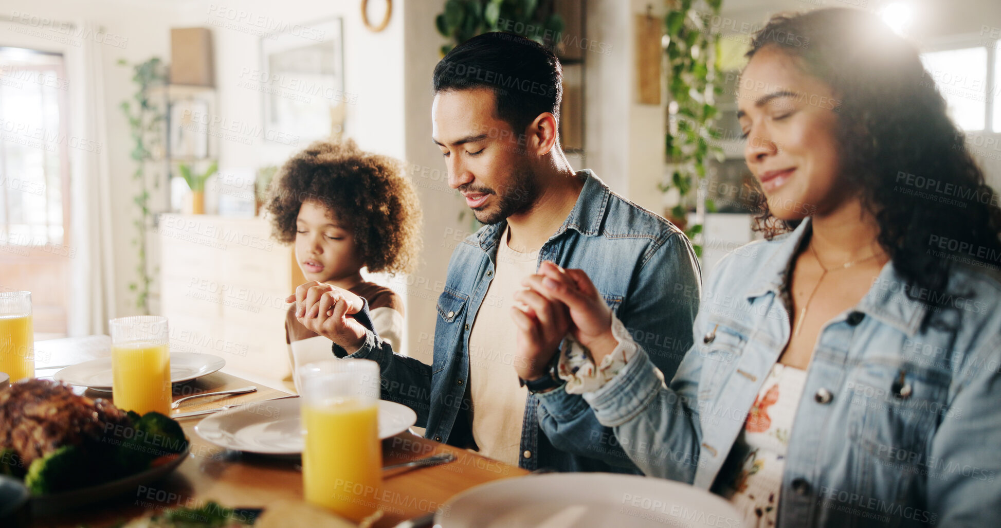 Buy stock photo Dinner, parents and child holding hands with prayer in home for grace, gratitude and thankful for food. Spiritual family, people and blessing lunch with thanksgiving, religious and praise together