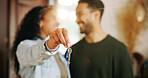 Couple, hand and keys with new home, moving in and finance investment together. Excited man, woman and smile with property, real estate or house for mortgage loan, renovation and relocation success
