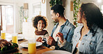 Dinner, happy and parents with child in home for family gathering, healthy feast and bonding at dining table. Support, interracial people and eating together for nutrition, lunch event and connection