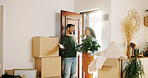 Couple, boxes and moving in with new home, relocation and finance investment together. Excited man, woman and smile with property, real estate or house for mortgage loan, renovation and success