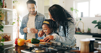 Buy stock photo Kitchen, family and learning with vegetables for cooking, nutrition and bonding together in home. Daughter, man and woman with chopping board for meal prep, teaching and support with girl and mother