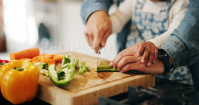 Buy stock photo Hands, parent and child with vegetables to chop, cooking and bonding with learning skills at home. Kitchen, kid and dad with teaching for cutting, organic food and meal prep with pepper in closeup