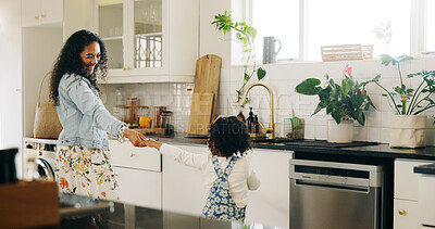 Buy stock photo Dancing, mother and girl in kitchen, home and bonding together with happiness, support and energy. Family, parent and mama with daughter, movement and child development with love, celebration or care