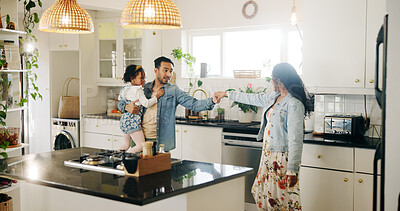 Buy stock photo Dance, family and holding hands in kitchen of home together for bonding, love or security. Development, safety or trust with mother, father and daughter in apartment for growth or relationship