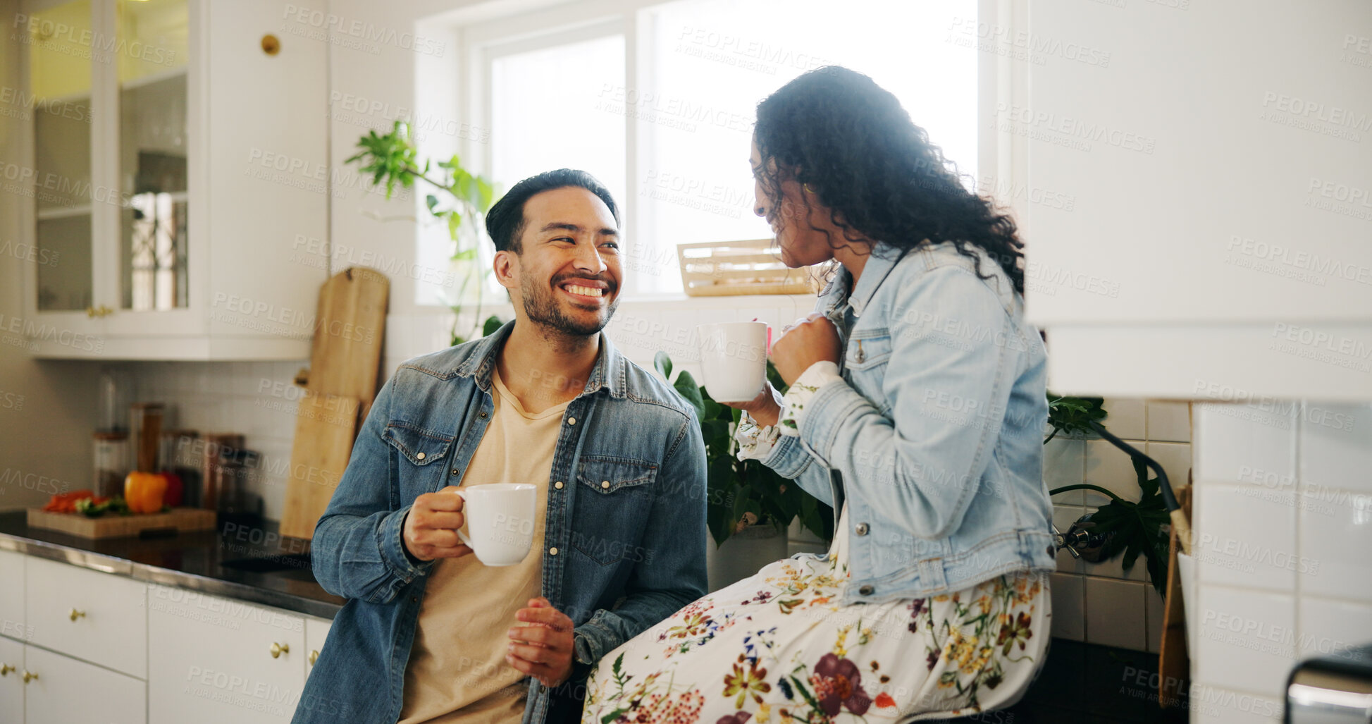 Buy stock photo Morning, coffee and couple in home kitchen with conversation, cup and mug with drink. Relax, communication and love of happy people with smile, house and marriage talking for breakfast plan with tea
