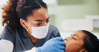 Buy stock photo Dentist, child and check mouth with gloves for cleaning, inspection and help for oral care at clinic. Woman, girl and medical exam for dental assessment, cavity and services for wellness at hospital