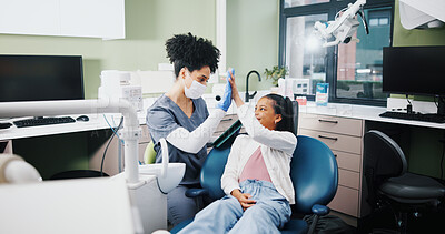 Buy stock photo Dentist, girl and high five with smile for results, motivation or support for oral health at hospital. Woman, child and celebration for teeth whitening, happy or tooth extraction with care at clinic