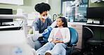 Dentist, girl and mold with teaching for dental wellness, care and listening to advice at hospital. Woman, child and model teeth for learning, talk and consultation for health services at clinic