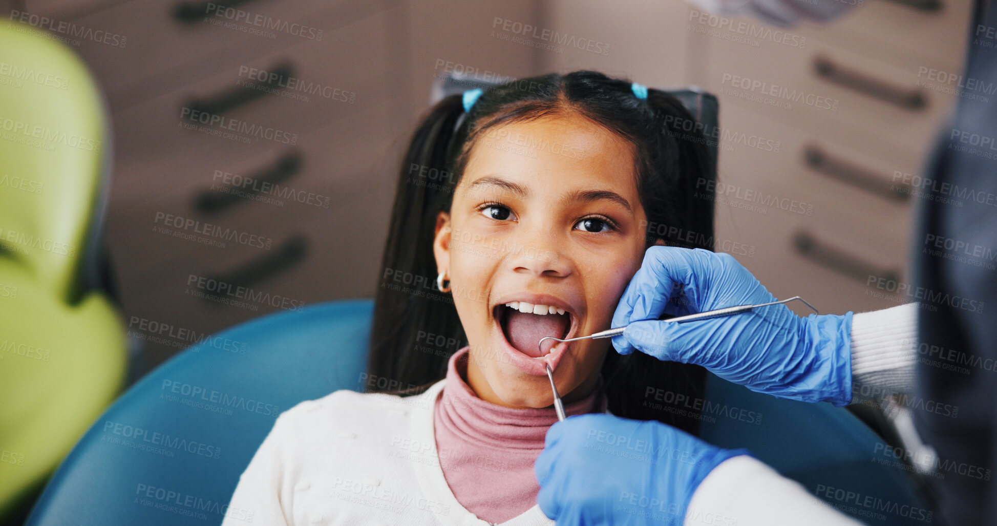 Buy stock photo Child, dentist and portrait in consultation for dental care, plaque removal and cavity inspection with tools. Girl, orthodontist hands and oral exam in practice for cleaning, check gums and service