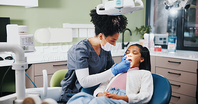 Buy stock photo Dentist, girl and check mouth with mirror for cleaning, inspection and help for oral care at clinic. Woman, child and medical tools for dental assessment, exam and services for wellness at hospital