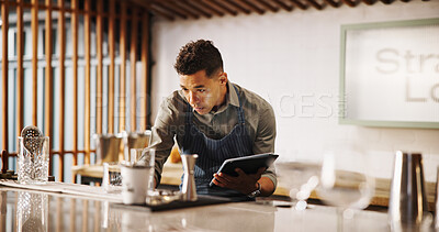 Buy stock photo Cocktail, cafe and bartender man with tablet for recipe research, stock management or online order. Mixology, drinks or server on digital app for inventory checklist, menu planning and small business