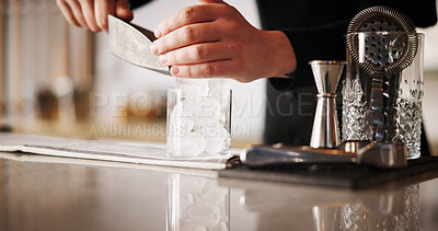 Buy stock photo Cocktail, ice and hands of bartender man with glass, cafe and tools for artisan beverage recipe. Mixology, small business pub and barman at counter with happy hour drinks, process and craft alcohol