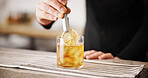 Cocktail, cafe and hands of barman with glass, ice and lemon for artisan beverage recipe. Mixology, small business pub and person at counter with happy hour drinks, process and craft alcohol