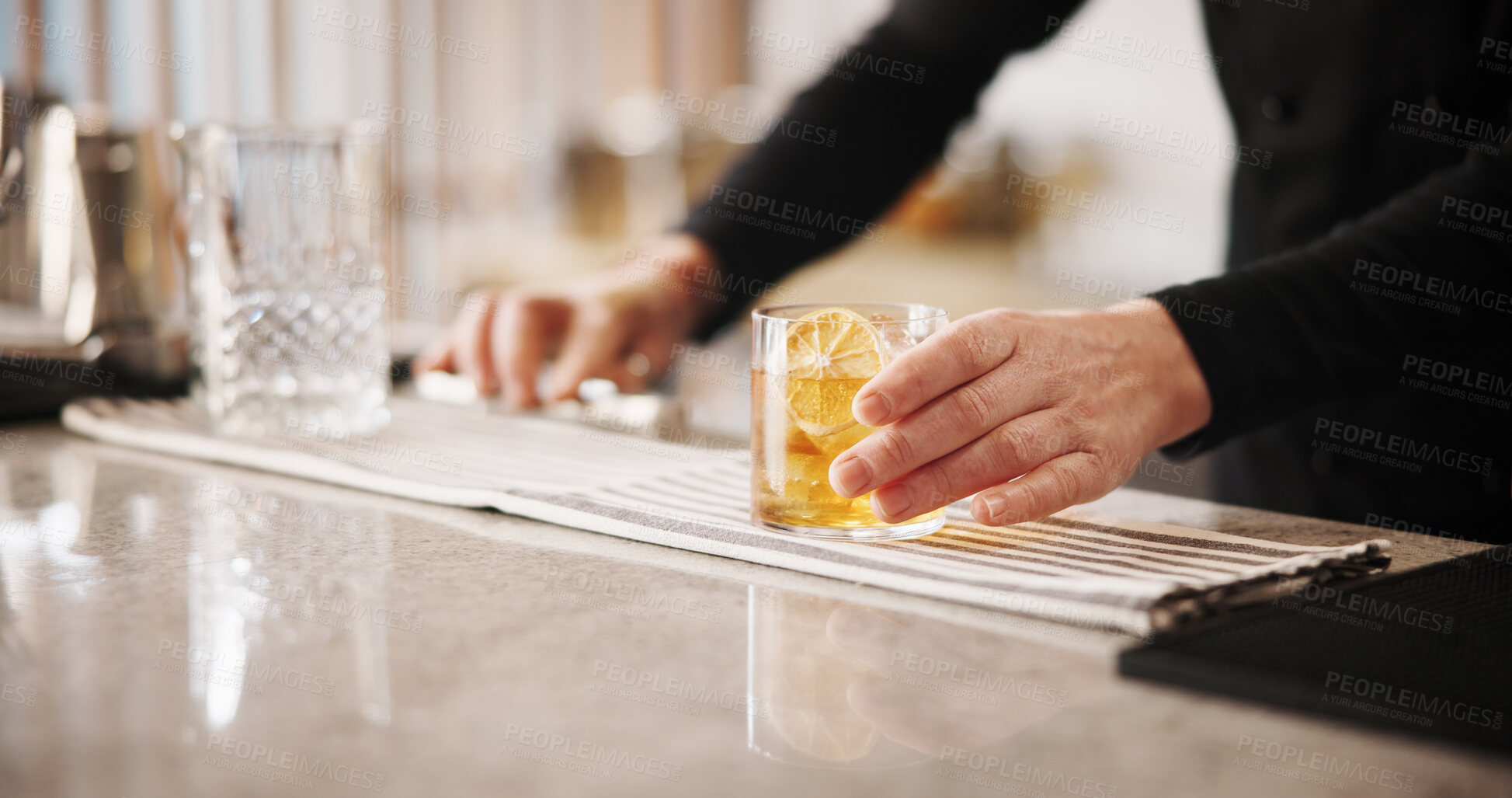 Buy stock photo Cocktail, cafe and hands of bartender with glass, ice and lemon for artisan beverage recipe. Mixology, small business pub and person at counter with happy hour drinks, hospitality and craft alcohol