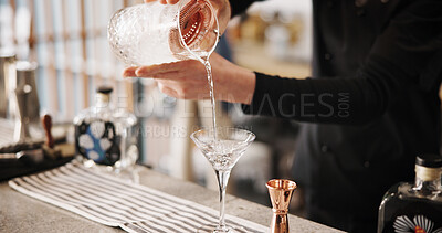 Buy stock photo Cocktail, mixology and hands of barman with martini glass, jug and tools for artisan beverage recipe. Cafe, small business pub and person at counter with happy hour drinks, process and craft alcohol