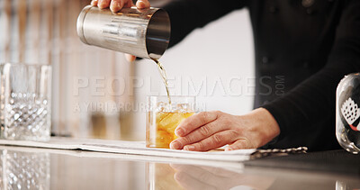 Buy stock photo Cocktail, mixology and hands of barman with whiskey glass, ice and tools for artisan beverage recipe. Cafe, small business pub and person at counter with happy hour drinks, process and craft alcohol