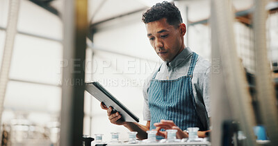 Buy stock photo Distillery, tablet and man in factory for alcohol production, manufacturing or distribution checklist. Brewery, industrial business and person on tech for fermentation, quality control and inspection