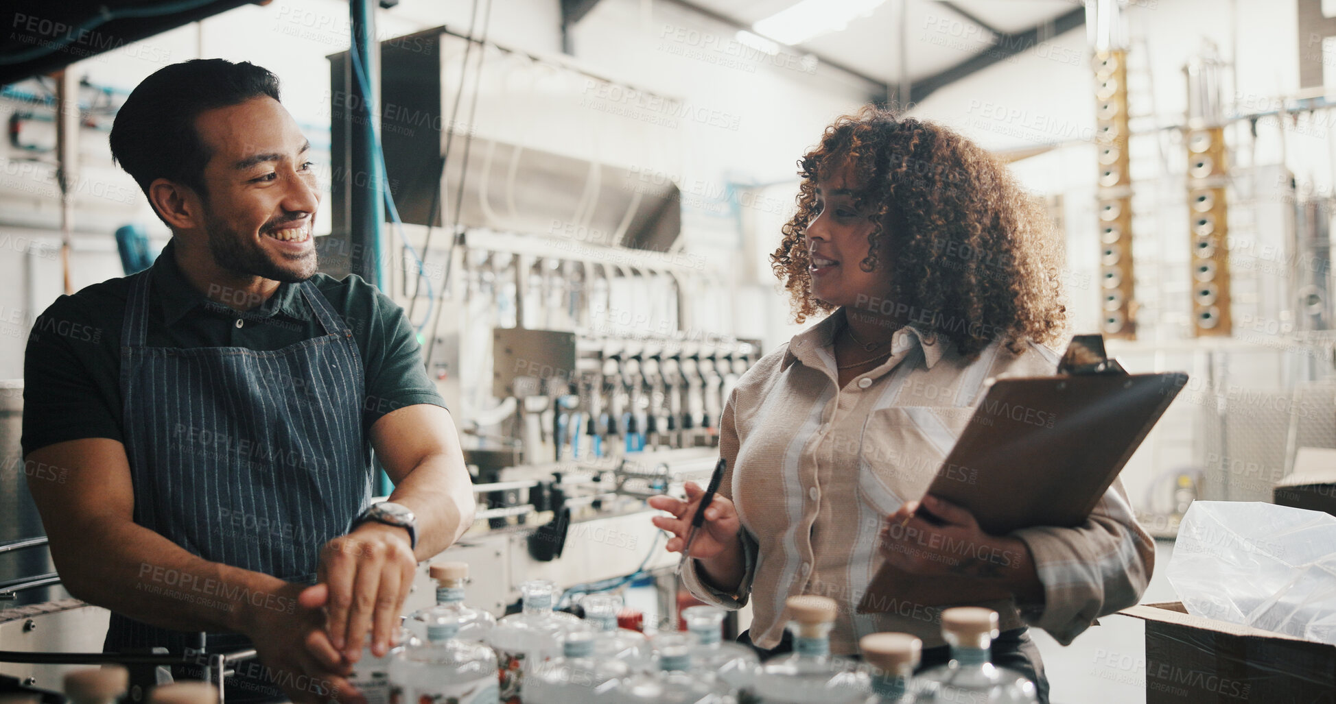 Buy stock photo Distillery, team and smile with people in factory for packaging, drink production and bottle checklist. Manufacturing, inventory and distribution with employees in warehouse for quality control