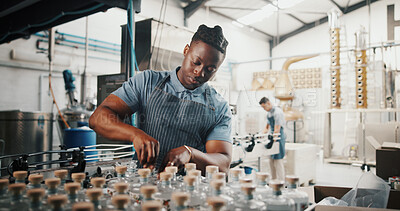 Buy stock photo Distillery, bottle and logistics with man in factory for packaging, assembly line and supply chain inspection. Manufacturing, inventory and distribution with person in warehouse for quality control