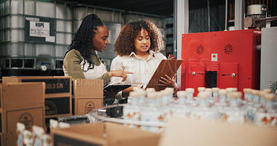 Buy stock photo Distillery, team and inspection with women in factory for packaging, drink production and bottle checklist. Manufacturing, inventory and distribution with people in warehouse for quality control