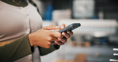 Buy stock photo Hands, phone and typing with person in factory for manufacturing or production process closeup. App, communication and text message with plant or warehouse employee at work for quality control