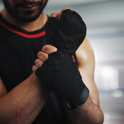 Hands, wrist pain and boxer with man in gym for sports injury, mma risk ...