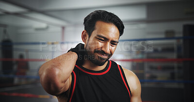 Buy stock photo Man, neck pain and stress at gym for boxing by ring for injury, muscle fatigue or frustrated at training center. Person, burnout and athlete with inflammation, mixed martial arts or fitness at club