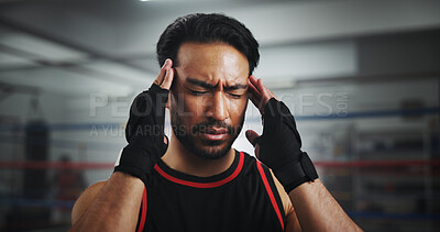 Buy stock photo Man, headache and stress at gym for boxer by ring for fight, fatigue and concussion at training center. Person, migraine and athlete with pain, mixed martial arts and vertigo at fitness club