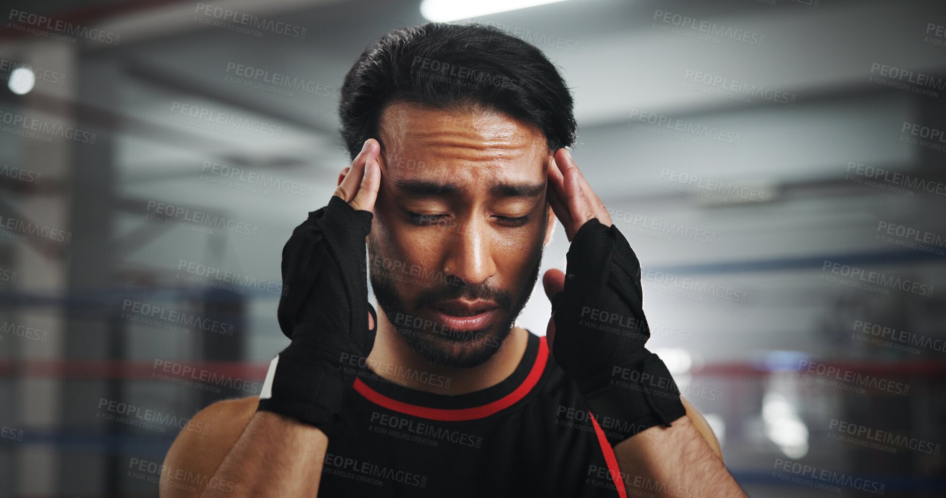 Buy stock photo Man, headache and pain at gym for boxer by ring for fight, fatigue and concussion at training center. Person, migraine and athlete with stress, mixed martial arts and vertigo at fitness club