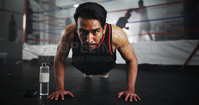 Buy stock photo Man, push ups and boxer in gym for fitness, warm up or ready for training for match, strength and muscle. Serious, sports and boxing ring with athlete, start or prepare for performance with power