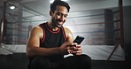 Man, phone and smile at gym by boxing ring with notification for invite to global contest at training center. Person, athlete or fighter with smartphone, happy and social network at martial arts club