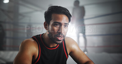 Buy stock photo Man, boxer and tired with workout in gym, intense and recovery with sweating for self defense exercise. Serious, fatigue and rest with exhausted male athlete, fitness and endurance by boxing ring