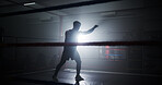 Person, silhouette and boxing in ring for training, punch and power with routine for combat sports. Athlete, fighter and mixed martial arts with workout, fitness and ready for competition at club