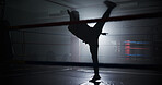 Person, silhouette and kick in ring at gym, training and power with routine for combat sports. Athlete, fighter and mixed martial arts with workout, exercise and ready for competition at fitness club