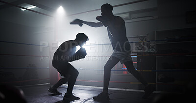 Buy stock photo Punch, team and silhouette with men in boxing ring for sparring practice, boxer training and fitness coaching. Mma club, wrestling and martial arts fighter with people in gym for personal trainer