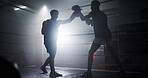 Punch, teaching and silhouette with men in boxing ring for sparring practice, boxer training and fitness coaching. Mma club, wrestling and martial arts fighter with people in gym for personal trainer