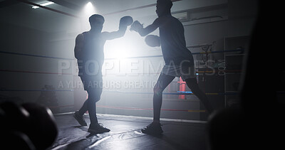 Buy stock photo Punch, sports and teaching with men in boxing ring for sparring practice, boxer training and fitness coaching. MMA club, challenge and martial arts fighter with people in gym for personal trainer