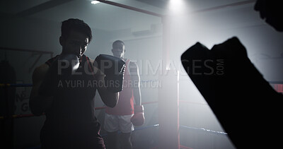 Buy stock photo Man, boxer and training in ring with coach, fitness and punch with power, challenge and workout at gym. Person, athlete or fighter with guard, strong and routine for combat sports at exercise club