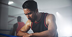 Man, boxer and breathing in gym, tired with intense recovery and mindset for self defense exercise. Serious, fatigue and rest with exhausted male athlete, fitness and endurance workout in boxing ring