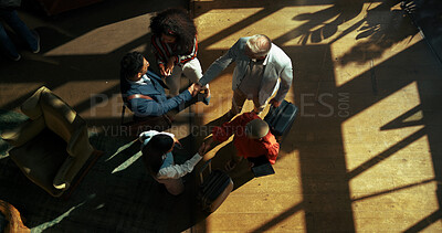 Buy stock photo Business, people and handshake in lobby for travel to global convention, corporate seminar and b2b collaboration. Above, professional and shaking hands with luggage for team introduction and welcome