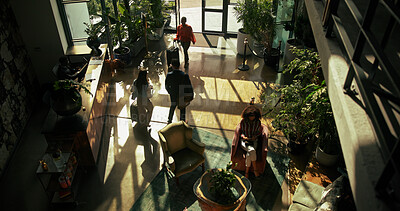 Buy stock photo Above, business trip and people in lobby of hotel for checkin, arrival or reception desk. Hospitality, men and women at entrance of travel accommodation with luggage, service or walking with suitcase