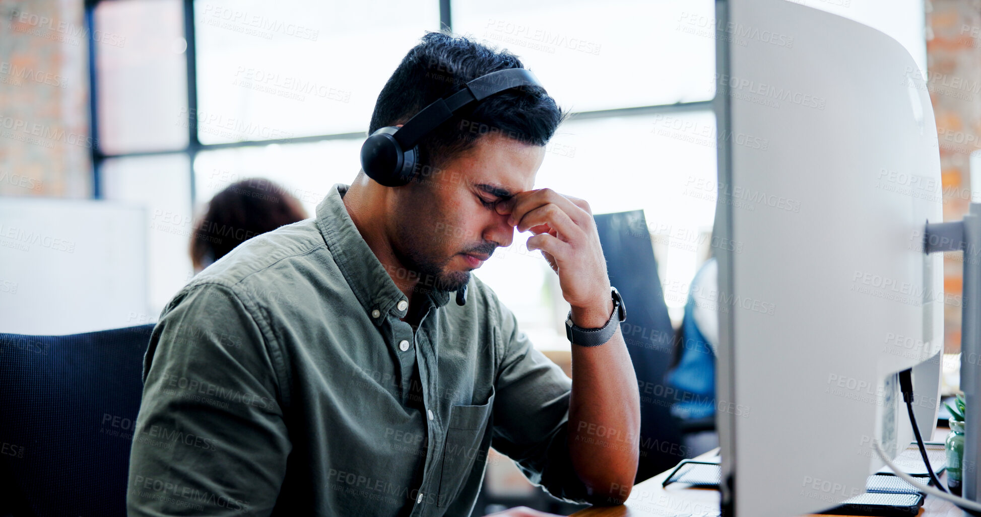 Buy stock photo Computer, headache and stress with man in call center for assistance, feedback or problem solving. Burnout, contact us and frustration with unhappy employee at work for customer service or support