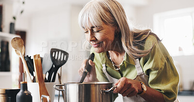 Buy stock photo Aroma, cooking and mature woman in kitchen in home with smelling dinner, meal or dish. Happy, pot and female person with satisfaction for scent of supper with health, wellness and nutrition in house.