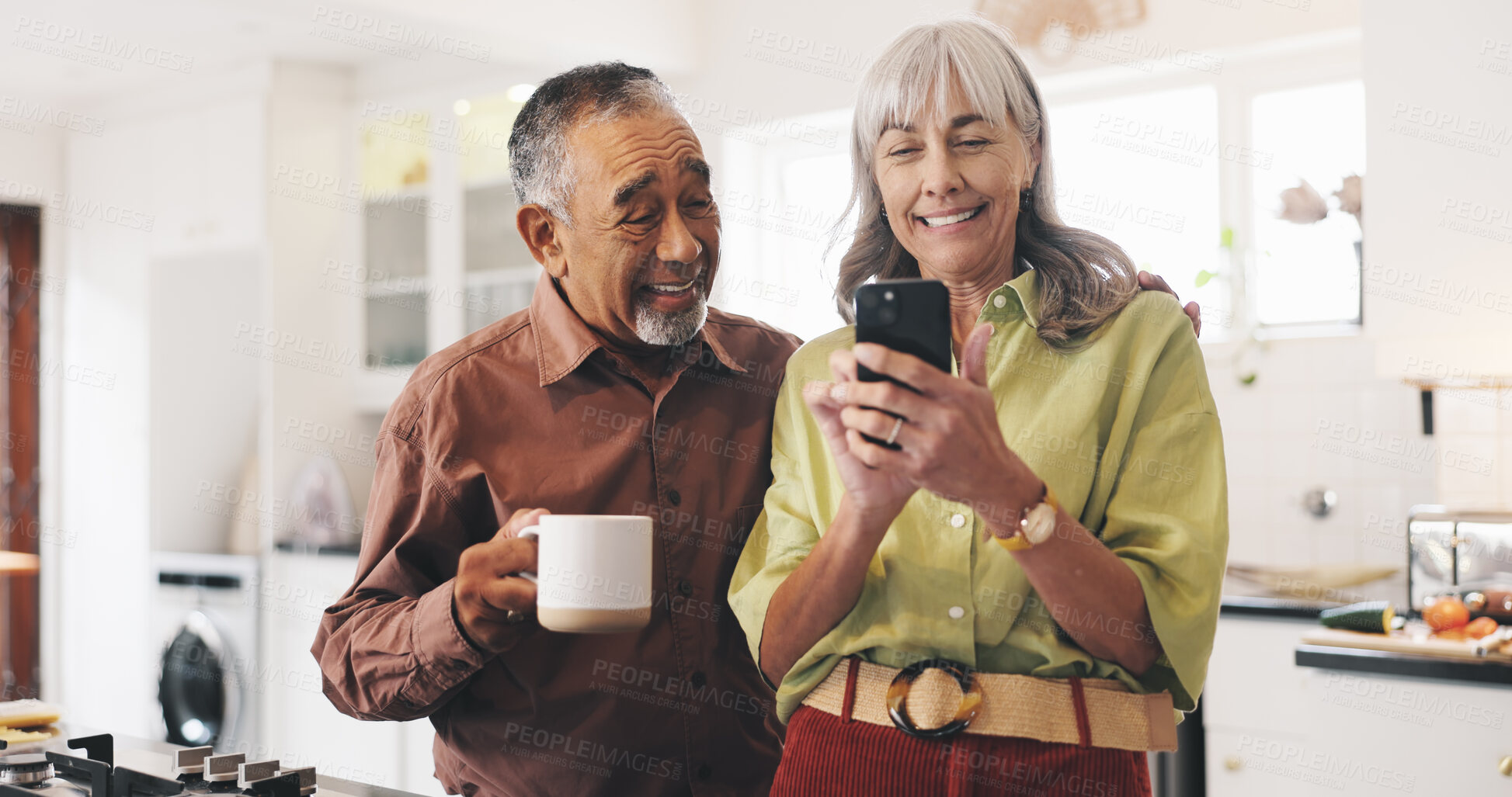 Buy stock photo Happy, phone and mature couple in kitchen in home reading online news for political update. Coffee, smile and man with woman for mobile app on cellphone for blog post with bonding in morning at house