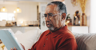 Buy stock photo Senior man, tablet and confused with living room, sofa and reading online news blog post. Question, digital technology and mature person with internet spam, social media and retirement at home