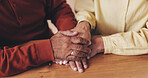 Home, table and old couple with holding hands for empathy, support and comfort to partner with grief. Closeup, senior people and love with sympathy for loss, compassion and kindness with commitment