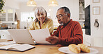 Elderly couple, documents and finance in home for results, laptop or smile with goal for pension. Interracial relationship, man and woman for investing, happy or profit for retirement income in house