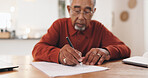 Senior man, finance and hands with documents for retirement funding, tax and compliance in home. Elderly person, signature and paperwork for pension, budget and review for investment at apartment