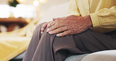 Buy stock photo Hands, knee pain and massage with mature person on sofa in living room of home for arthritis. Accident, inflammation or joint injury and senior in apartment with osteoarthritis or tendinitis