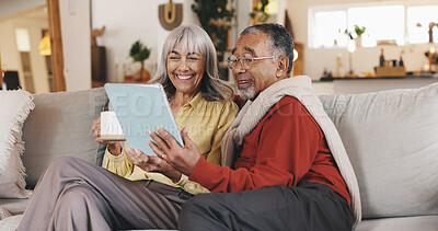 Buy stock photo Home, tablet and old couple on sofa, smile and conversation with retirement, app and love. Social media, apartment and senior man with elderly woman, tech and entertainment with message or connection